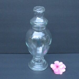 Glass lidded apothecary jar
